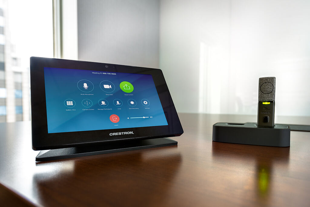 Collaboration display and tabletop control panel in a finished meeting space